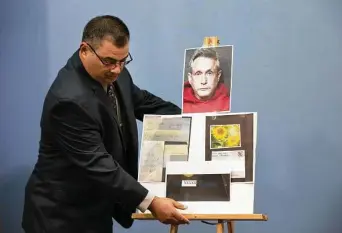  ?? Yi-Chin Lee / Staff photograph­er ?? HPD Detective Sgt. J. Varela shows evidence in the arrest of Robin Chiswell, 61, who was accused of sending threatenin­g letters to Houston socialite Carolyn Farb and to ex-A&M coach Kevin Sumlin.