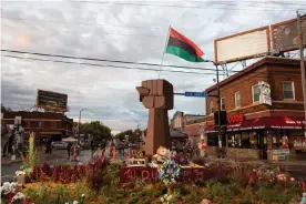  ??  ?? At the intersecti­on of 38th Street and Chicago Avenue, sits a memorial for George Floyd. Photograph: Jenn Ackerman/The Guardian