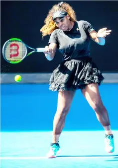  ?? — AFP photo ?? Serena plays a forehand shot during a practice session in Melbourne, ahead of the Australian Open tennis tournament.