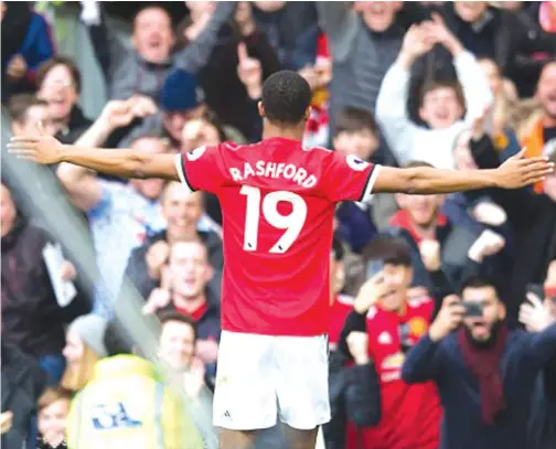  ??  ?? ON FIRE . . . Marcus Rashford salutes the crowd