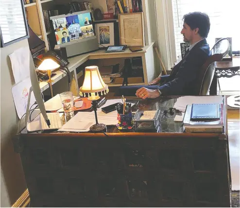  ?? Prime Minister’s Office / Handout via REUTERS ?? Prime Minister Justin Trudeau speaks with G7 leaders from his home at Rideau Cottage last week during a teleconfer­ence while under self-isolation, due to his wife Sophie Grégoire Trudeau testing positive for novel coronaviru­s.