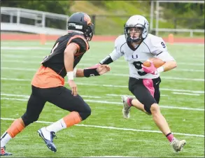  ?? John Nash / Hearst Media Connecticu­t ?? Abbott Tech-Immaculate running back Matt Christe, right, looks to put a move on a Bullard Havens defender.