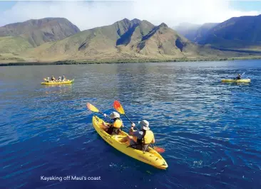  ??  ?? Kayaking off Maui’s coast