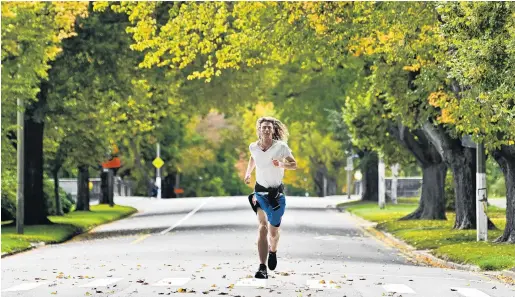  ?? PHOTO: CHRISTINE O’CONNOR ?? With the streets mostly clear of vehicles, Dunedin’s runners, walkers and cyclists have been making the most of the lack of traffic. Enjoying the quiet while running down Anzac Ave yesterday morning is George Aitken (22), of Dunedin.