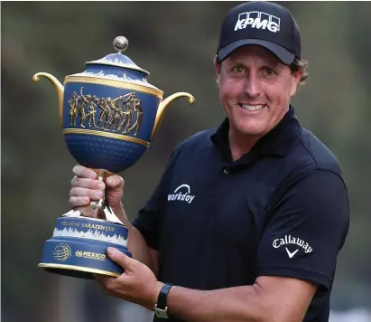  ?? GETTY IMAGES ?? Phil Mickelson lifts the Gene Sarazen Cup after his play-off victory at the WGC-Mexico Championsh­ip