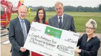  ?? Phil Greig ?? ●● Kevin Wilson (chief Executive) and Clare Beardmore (Head of Marketing) presenting a Donation cheque to West midlands Air Ambulance