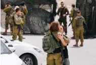  ?? Photo: Reuters ?? Israeli soldiers near the scene of the border shootings.