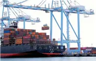  ?? AP Photo/Ted S. Warren ?? ■ Cargo cranes are used to unload containers from a Yang Ming Marine Transport Corp. container ship Nov. 4, 2019, at the Port of Tacoma in Tacoma, Wash. The U.S. trade deficit surged in July to $63.6 billion, the highest level in 12 years.