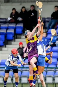  ??  ?? Aine Lacey in a duel in the air with Waterford’s Niamh Rockett.