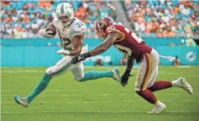  ?? STEVE MITCHELL/USA TODAY SPORTS ?? Kenyan Drake averaged 3.7 yards per carry in limited play this season for the Dolphins before being traded to the Cardinals.