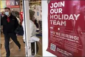  ?? NAM Y. HUH — THE ASSOCIATED PRESS ?? A holiday hiring sign is displayed at a retail store in Vernon Hills, Ill., on Saturday.