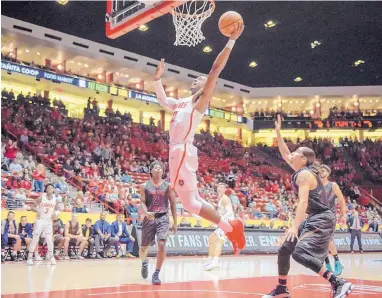  ?? ROBERTO E. ROSALES/JOURNAL ?? New Mexico’s Sam Logwood goes up for a slam after stealing the ball on an inbounds pass against Northern New Mexico on Saturday night in the Pit. He had 14 points in 17 minutes of play.