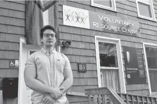  ?? MICHAEL ROBAR • THE GUARDIAN ?? Connor Kelly, tenant network co-ordinator with P.E.I. Fight for Affordable Housing, stands outside the Voluntary Resource Centre in Charlottet­own.