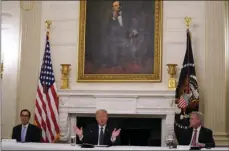  ?? AP PHOTO/EVAN VUCCI ?? House Minority Leader Kevin McCarthy of Calif., right, and Treasury Secretary Steven Mnuchin, left, listen as President Donald Trump speaks during a meeting with Republican lawmakers, in the State Dining Room of the White House, Friday in Washington.