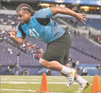  ?? By Brian Spurlock, US Presswire ?? Star of the day: Defensive tackle Dontari Poe posted unexpected­ly good numbers at the NFL combine in February.