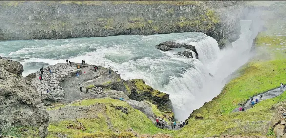  ?? CAMERON HEWITT ?? Gullfoss waterfall is just one of many of Iceland’s natural wonders that you can visit during a one-day layover; just be sure to prepare in advance.