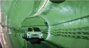  ?? ROBYN BECK
AFP via Getty Images ?? A modified Tesla Model X is driven in a test tunnel in Hawthorne, Calif., in 2018. Miami Mayor Francis Suarez’s new vision involves a pedestrian tunnel system connecting commuters from Brickell to Little Haiti.