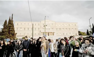  ?? ARIS MESSINIS/AGENCE FRANCE-PRESSE ?? SUPPORTERS of the LGBTQ community gather outside the Greek parliament as lawmakers vote on a same-sex marriage and adoption for same-sex couples bill.