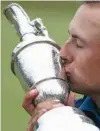  ?? Associated Press ?? n Jordan Spieth of the United States kisses the trophy after winning the British Open Golf Championsh­ips on Sunday at Royal Birkdale, Southport, England.