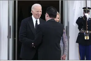  ?? (AP/Susan Walsh) ?? President Joe Biden (left) and first lady Jill Biden (right) welcome Japanese Prime Minister Fumio Kishida and his wife Yuko Kishida for a State Dinner at the White House on Wednesday.