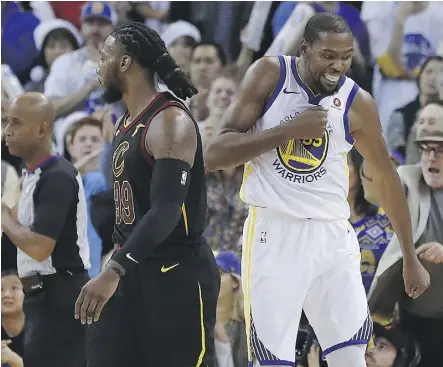  ?? TONY AVELAR/THE ASSOCIATED PRESS ?? Warriors forward Kevin Durant, right, blocked a key late shot by LeBron James and celebrated in front of Cleveland’s Jae Crowder during Golden State’s victory Monday in Oakland.