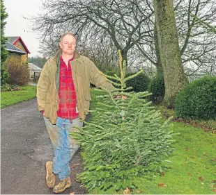  ??  ?? Farmer James Paton is being sued for £2 million after claims that he spoiled crops of Christmas trees which were in his care.