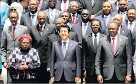  ??  ?? PARTNERING: Front from left, AU Commission chairwoman Nkosazana Dlamini Zuma, Japanese Prime Minister Shinzo Abe and Kenyan President Uhuru Kenyatta with African heads of state after the opening session of the Sixth Tokyo Internatio­nal Conference on...