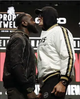  ?? ISAAC BREKKEN - THE ASSOCIATED PRESS ?? Tyson Fury, right, and Deontay Wilder face off Feb. 19 in Las Vegas.