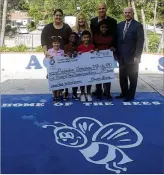  ??  ?? From left: Assistant Principal Hara Klimantiri­s, Instructio­nal Superinten­dent Dr. Jennifer Sanders, Chamber Chair Keith Spina, and Chamber CEO Dennis Grady present a check to Belvedere Elementary. Thank you to FPL, Reikenis &amp; Associates, Hulett Environmen­tal Services, and Don and Sally Chester for donating $1,000 each.