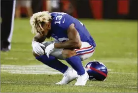  ?? RON SCHWANE - THE ASSOCIATED PRESS ?? New York Giants wide receiver Odell Beckham Jr. drops to the field after an injury in the first half of an NFL preseason football game against the Cleveland Browns Monday.