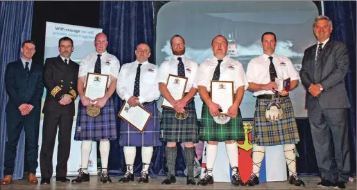  ??  ?? The gallant Islay lifeboat were honoured at Bowmore, with coxswain David MacLellan, second right, receiving the bronze medal.