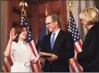  ?? Hans Pennink / Associated Press ?? New York Chief Judge Janet DiFiore swears in Kathy Hochul as the first woman to be New York's governor while her husband Bill Hochul holds a bible during a ceremonial swearing-in ceremony at the state Capitol on Tuesday, in Albany, N.Y.