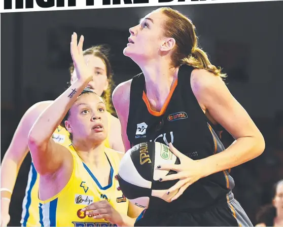  ?? TURNING UP HEAT: Townsville Fire centre Darcee Garbin in action during her team’s win over the Bendigo Spirit on Saturday night. Picture: ZAK SIMMONDS ??