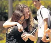  ?? Al Seib Los Angeles Times ?? STUDENT Mai Que Vo, left, comforts India McFarlane on campus a day after the UCLA shooting.