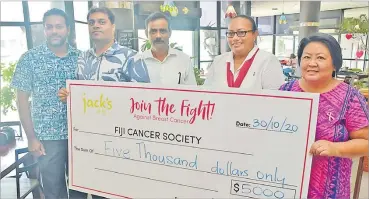  ?? Picture: REINAL CHAND ?? Jack’s of Fiji brands and PR officer Roneel Singh (left) with marketing manager Rupesh Kumar and Jacks Garments general manager Pankaj Sinha and Fiji Cancer Society representa­tives Marie Sitiveni and Margie Erbsleben during the hand over in Nadi.