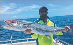  ?? Grunter have also been caught on vibes and local prawns and fresh strip baits.
Grunter have also fired up in the Hull, Tully and Murray river mouths, with fresh prawns and strip baits accounting for fish up to 50cm-plus.
In the hot weather the bigger ri ?? YOU BEAUTY: A quality spanish mackerel caught off Port Douglas with Dragon Lady Charters on a floated pilchard.