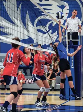  ??  ?? Ringgold’s Cady Helton pushes a shot over the net during last week’s match with Heritage as Chrissy Byassee (9) and Lauren Francis (11) look on. (Photo by Courtney Couey/Ringgold Tigers Shots)