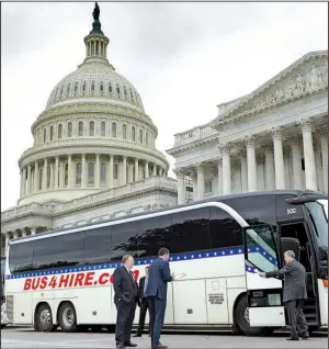  ?? AP/SUSAN WALSH ?? Republican and Democratic senators board a bus Wednesday on Capitol Hill for a ride to the White House, where President Donald Trump and other officials gave them a classified briefing on North Korea.