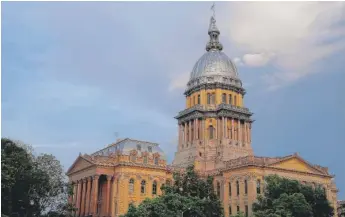  ?? SETH PERLMAN/ AP FILE ?? Illinois legislator­s are poised to introduce a budget onWednesda­y that would make major cuts to pensions and include reductions of $ 124 million to state agencies.