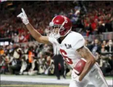  ?? DAVID GOLDMAN — THE ASSOCIATED PRESS FILE ?? Alabama wide receiver DeVonta Smith (6) celebrates his touchdown during overtime of the national championsh­ip game against Georgia.