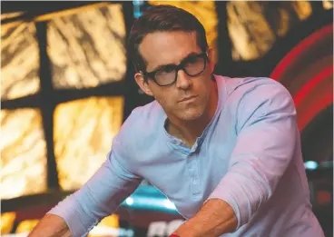  ??  ?? Ryan Reynolds took on the lead character in Free Guy because he loved the escapist messaging and viewed the project as an antidote to what he sees as the pervasive
oppressive news cycle in today’s world.