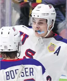  ?? SEAN KILPATRICK /THE CANADIAN PRESS ?? Top prospect, Auston Matthews, back, will be on the Toronto Maple Leafs’ mind for the next few weeks. The Leafs will have a 20 per cent chance of landing the No. 1 overall pick at the NHL draft lottery on April 30.