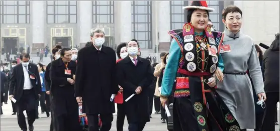  ?? JIN LIANGKUAI / XINHUA ?? Members of the Chinese People’s Political Consultati­ve Conference National Committee leave the Great Hall of the People in Beijing after the closing meeting on March 10. The two sessions of China’s top legislatur­e and political advisory body convened between March 4-11.