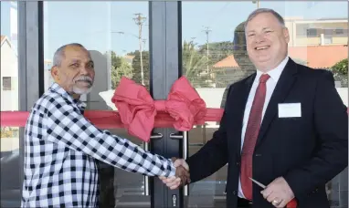  ??  ?? ‘THANK YOU’: Servest chief executive Steven Wallbanks, right, congratula­tes Fahried Barendse, the main contractor, on completion of the firm’s new head office, which has relocated to Ndabeni in Cape Town.