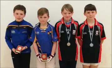  ??  ?? Michael Murphy and Barry Foley (Taghmon), the Under-11 boys’ doubles victors, with the runners-up from Ferns, Bobby Murray and Bill Moulds.