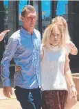  ??  ?? WALKING FREE: Daniel Cronn leaves the Cairns District Court with his loved ones.