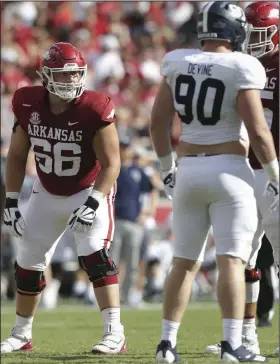  ?? (NWA Democrat-Gazette/Charlie Kaijo) ?? Arkansas offensive lineman Ty Clary (left) lines up at right tackle during the first half Saturday afternoon against Georgia Southern. Clary played three positions on the offensive line Saturday because of injuries to starters Dalton Wagner at right tackle and Ricky Stromberg at center. He also played at right guard.