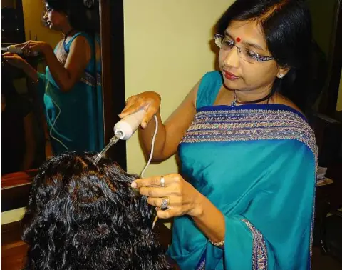  ??  ?? Neeta introduced her corrective formulas to halt hair loss