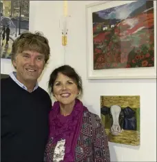  ??  ?? Shane and Moira Carberry with Moira’s painting Poppies.