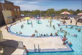  ??  ?? Swimmers keep cool in the Henderson Multigener­ational Center’s activity pool. The pool is one of three at the center, 250 S. Green Valley Parkway.